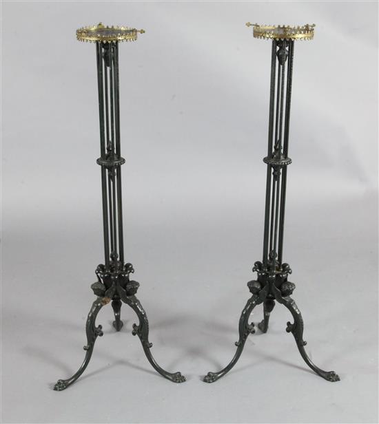 A pair of Regency cast iron candlesticks, height 33.5in.